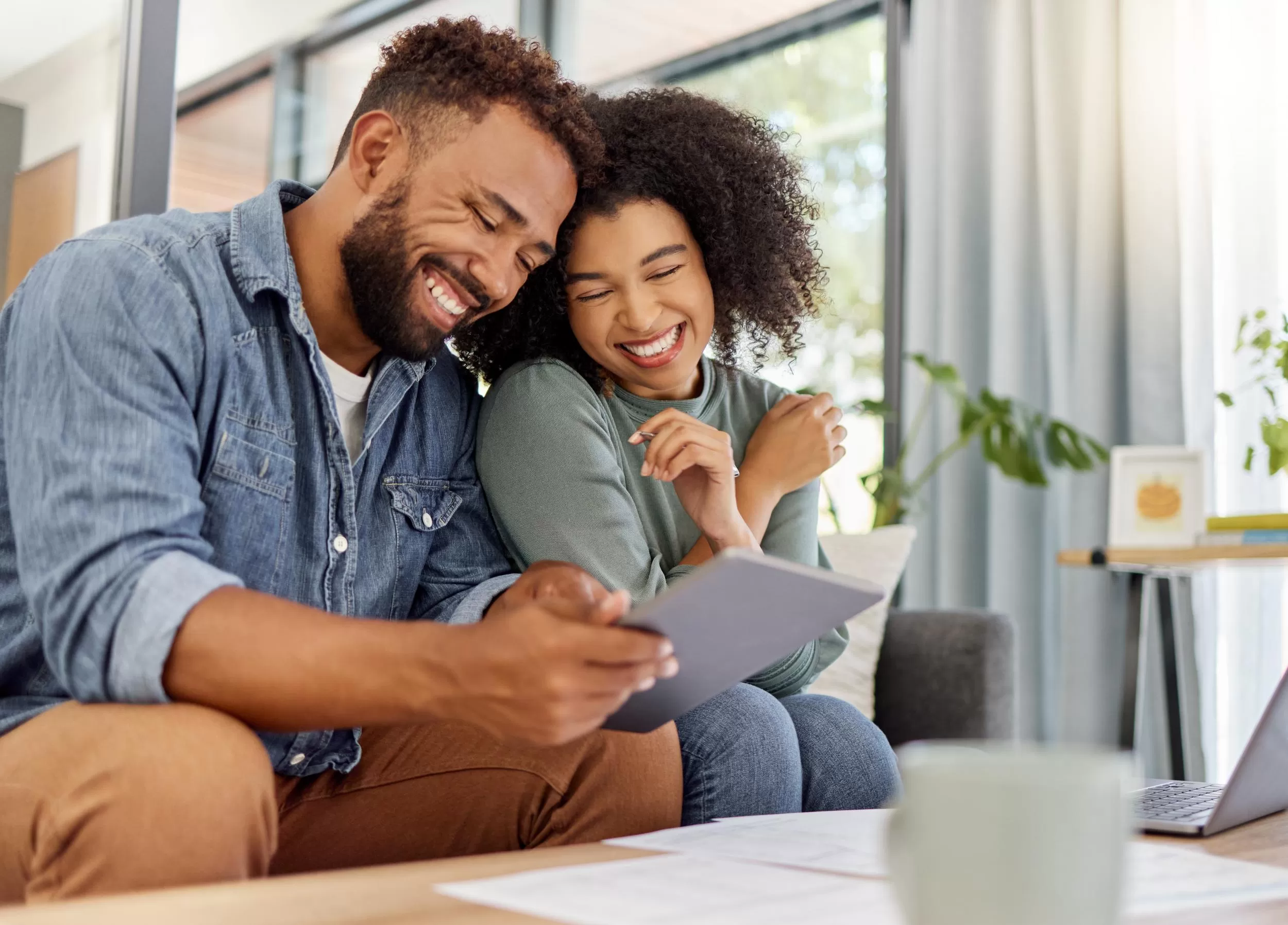 Happy Couple looking at tablet
